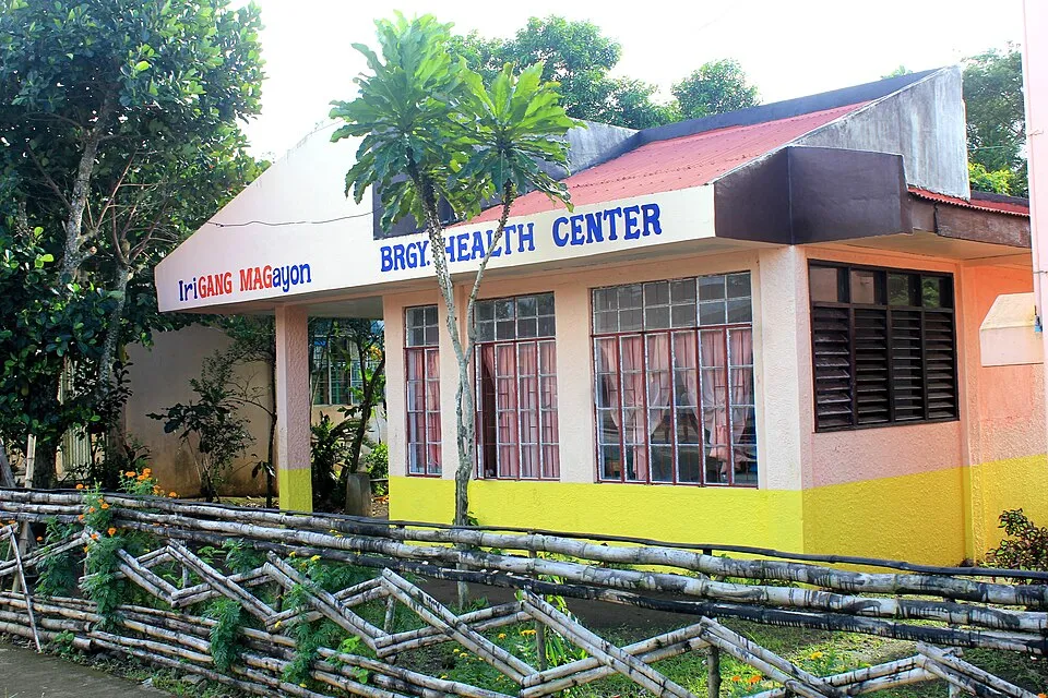 A small barangay health center stands beside a local road in Iriga City, Philippines.