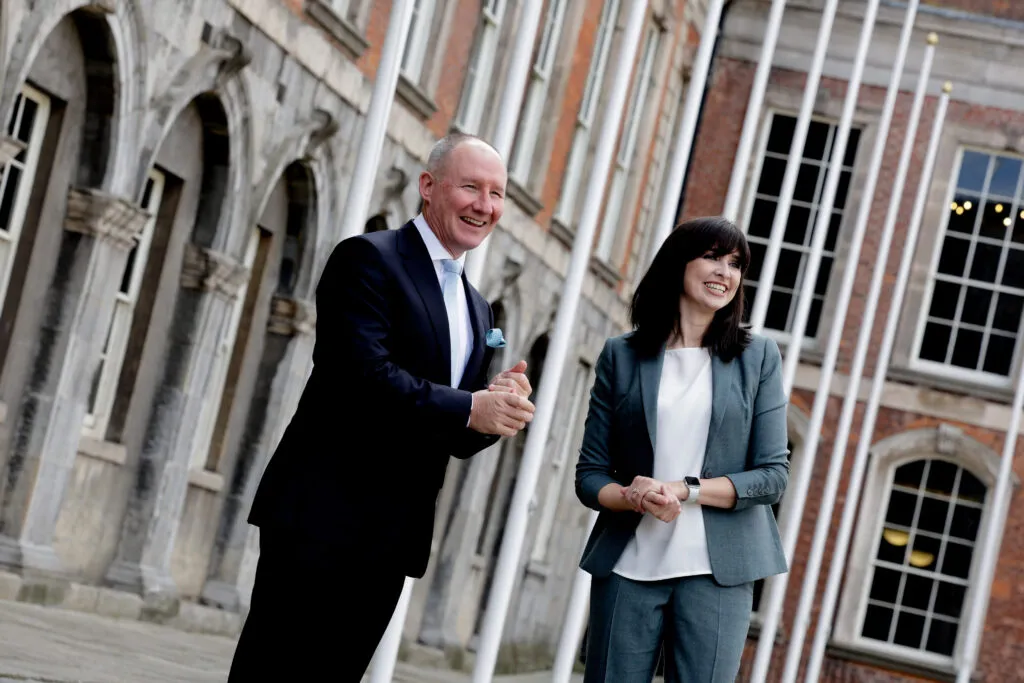 The chairs of two Irish Citizens' Assemblies stand outside Dublin Castle at their 2022 launch.