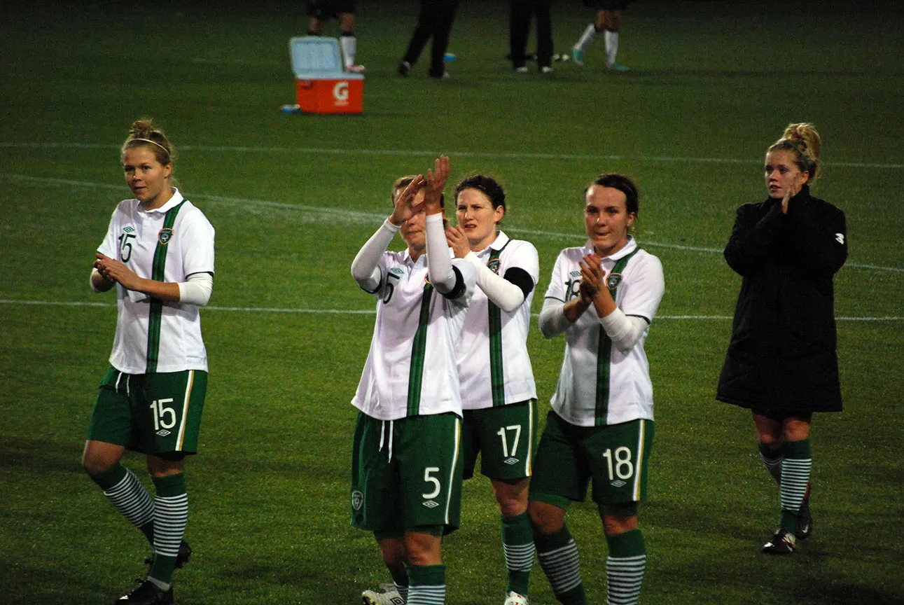Republic of Ireland women's national football players applaud after an international match.